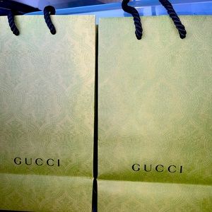 Bundle is 2 Gucci Paper shopping gift bags. Paper gift Bags only